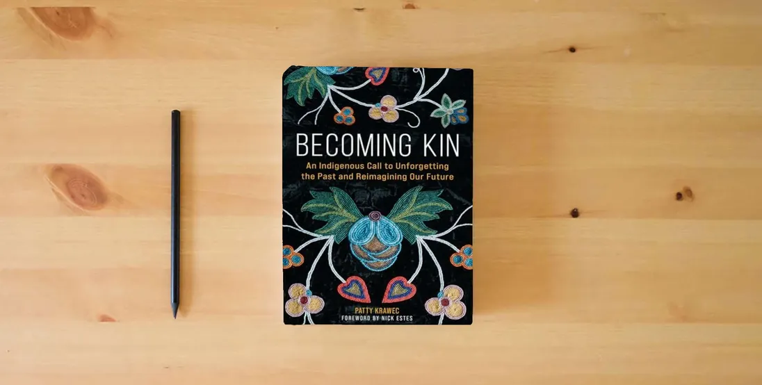 The book Becoming Kin: An Indigenous Call to Unforgetting the Past and Reimagining Our Future} is on the table
