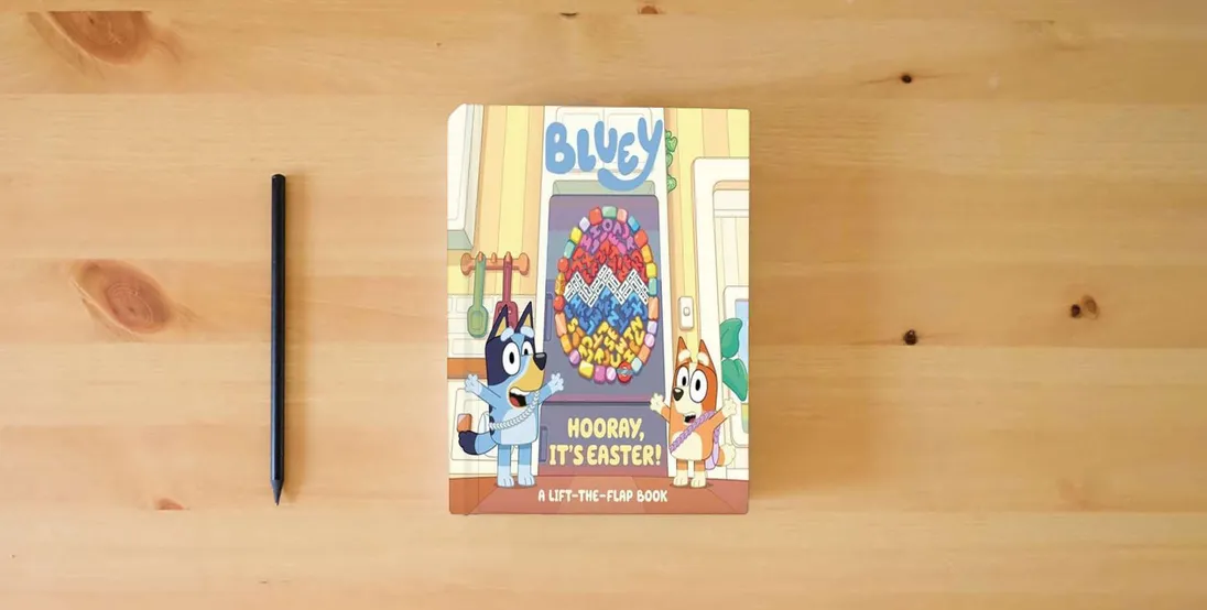 The book Bluey: Hooray, It's Easter!: A Lift-the-Flap Book} is on the table