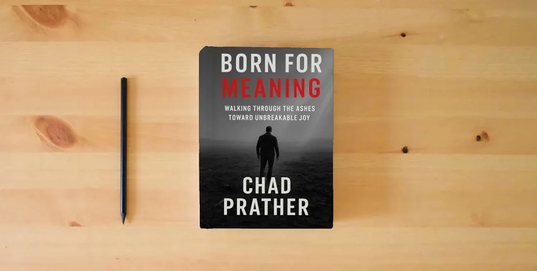 The book Born For Meaning: Walking Through The Ashes Toward Unbreakable Joy} is on the table