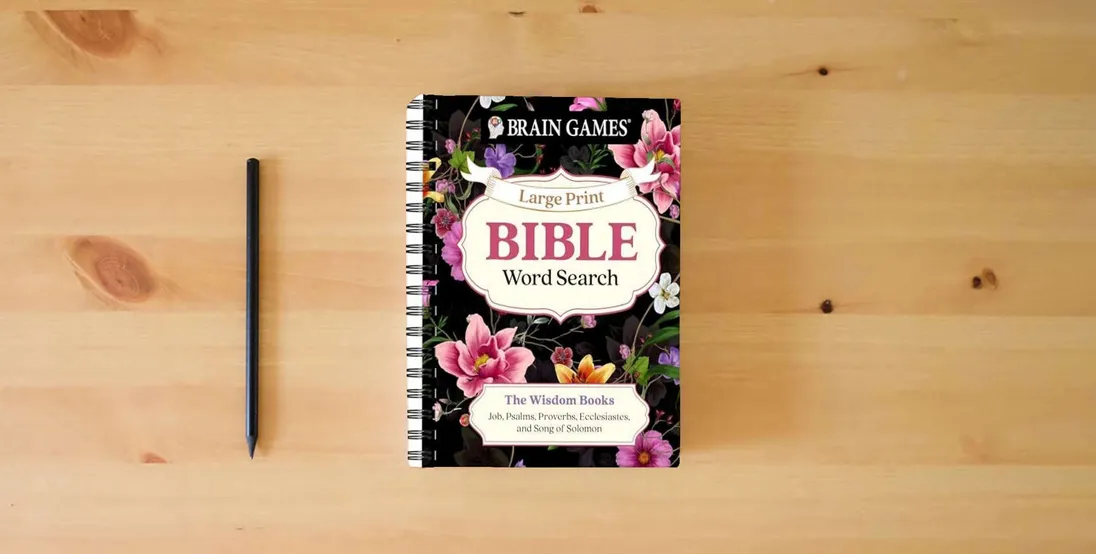 The book Brain Games - Large Print Bible Word Search: The Wisdom Books: Job, Psalms, Proverbs, Ecclesiastes, and Song of Solomon (Brain Games - Bible)} is on the table