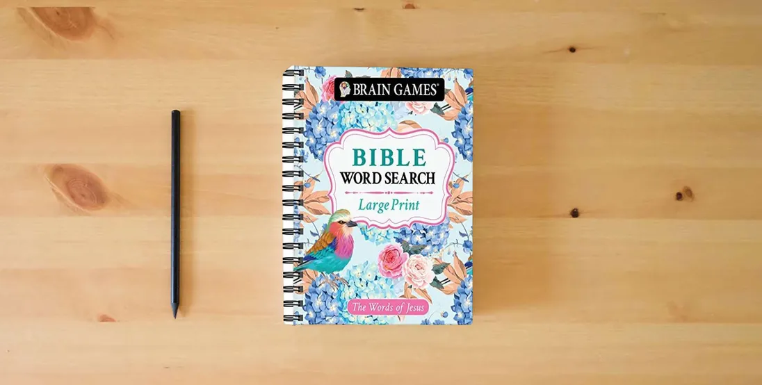 The book Brain Games - Large Print Bible Word Search: The Words of Jesus (Brain Games - Bible)} is on the table
