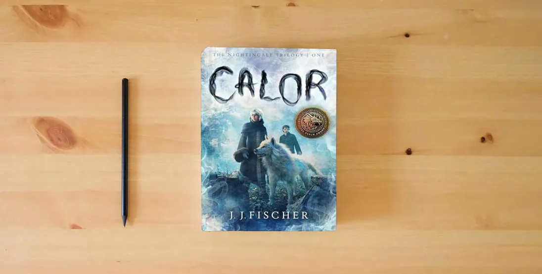 The book Calor (Volume 1) (The Nightingale Trilogy)} is on the table