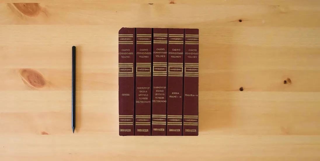 The book Calvins Commentaries (22 Volume Set)} is on the table