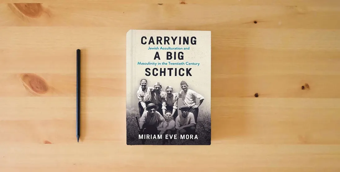 The book Carrying a Big Schtick: Jewish Acculturation and Masculinity in the Twentieth Century} is on the table