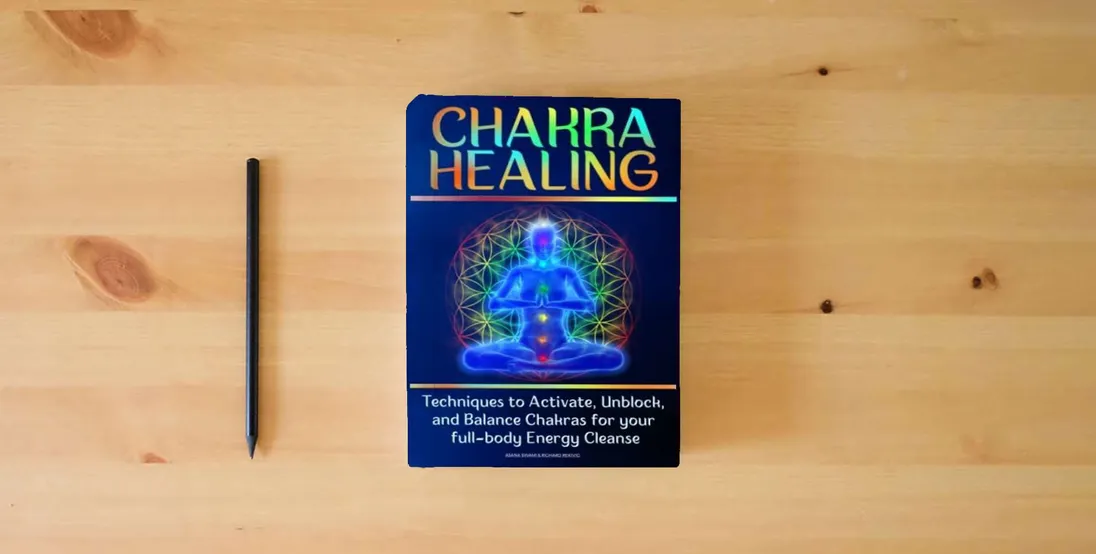 The book CHAKRA HEALING: Techniques to Activate, Unblock, and Balance Chakras for your full-body Energy Cleanse} is on the table