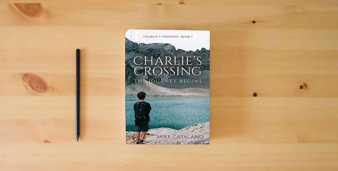 The book Charlie's Crossing: The Journey Begins} is on the table