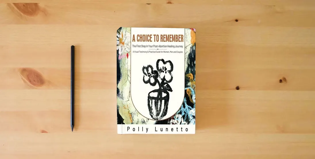 The book A Choice to Remember: The First Step in Your Post-Abortion Healing Journey} is on the table