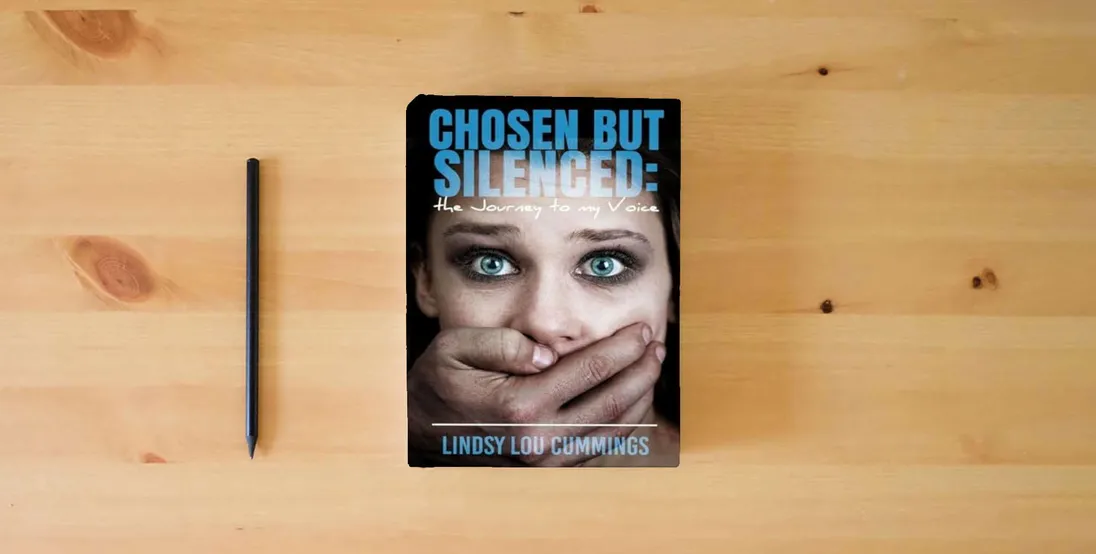 The book Chosen But Silenced: The Journey to My Voice} is on the table