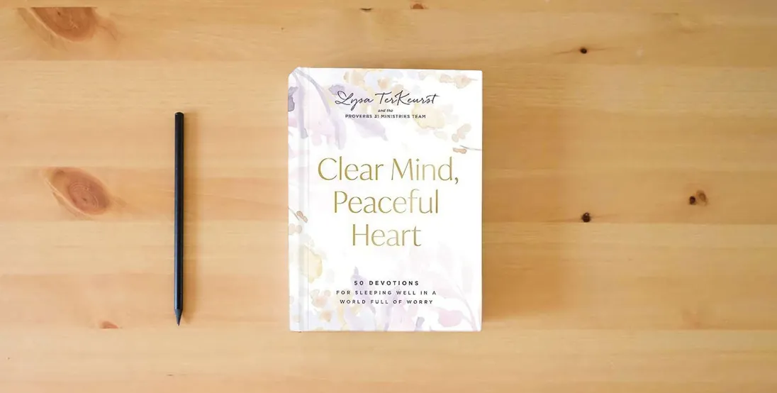 The book Clear Mind, Peaceful Heart: 50 Devotions for Sleeping Well in a World Full of Worry} is on the table