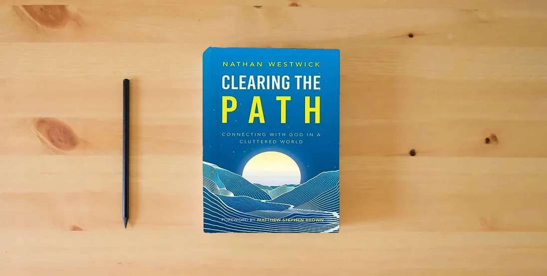 The book Clearing the Path: Connecting with God in a Cluttered World} is on the table