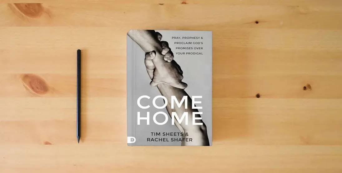 The book Come Home: Pray, Prophesy, and Proclaim God's Promises Over Your Prodigal} is on the table