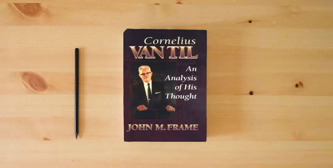 The book Cornelius Van Til: An Analysis of His Thought} is on the table