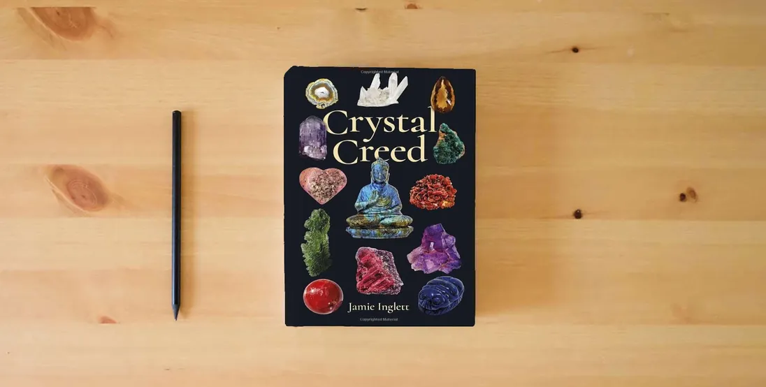 The book Crystal Creed} is on the table