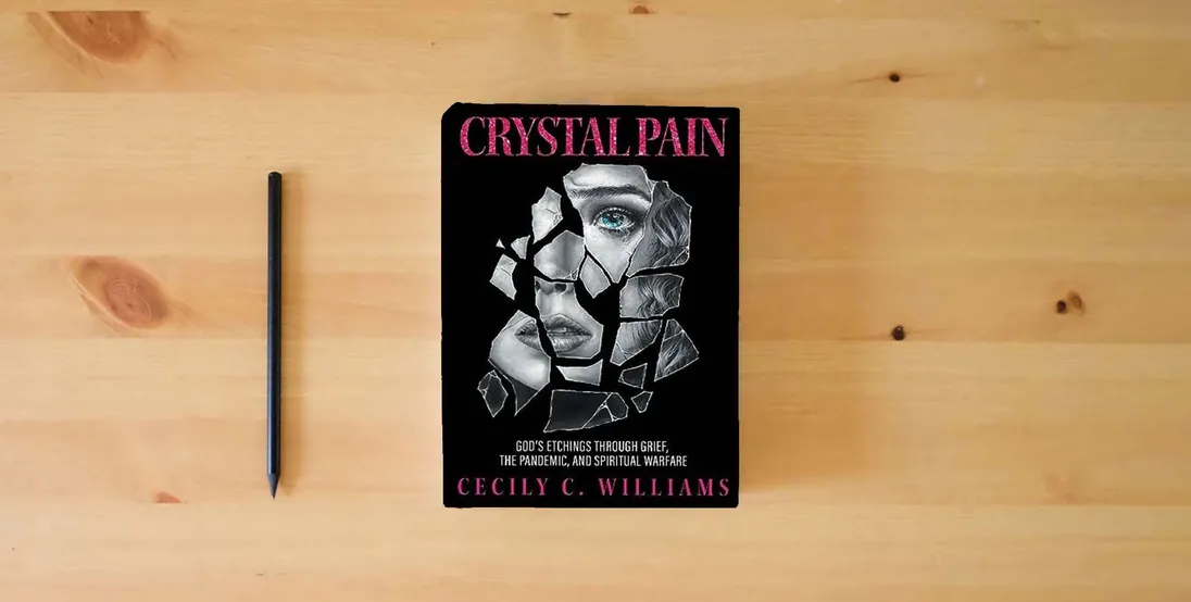 The book Crystal Pain: God's Etchings Through Grief, the Pandemic, and Spiritual Warfare} is on the table