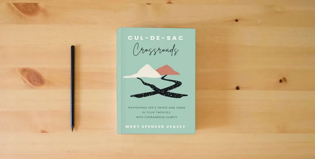 The book Cul-de-sac Crossroads: Navigating Life’s Twists and Turns in Your Twenties with Courageous Clarity} is on the table