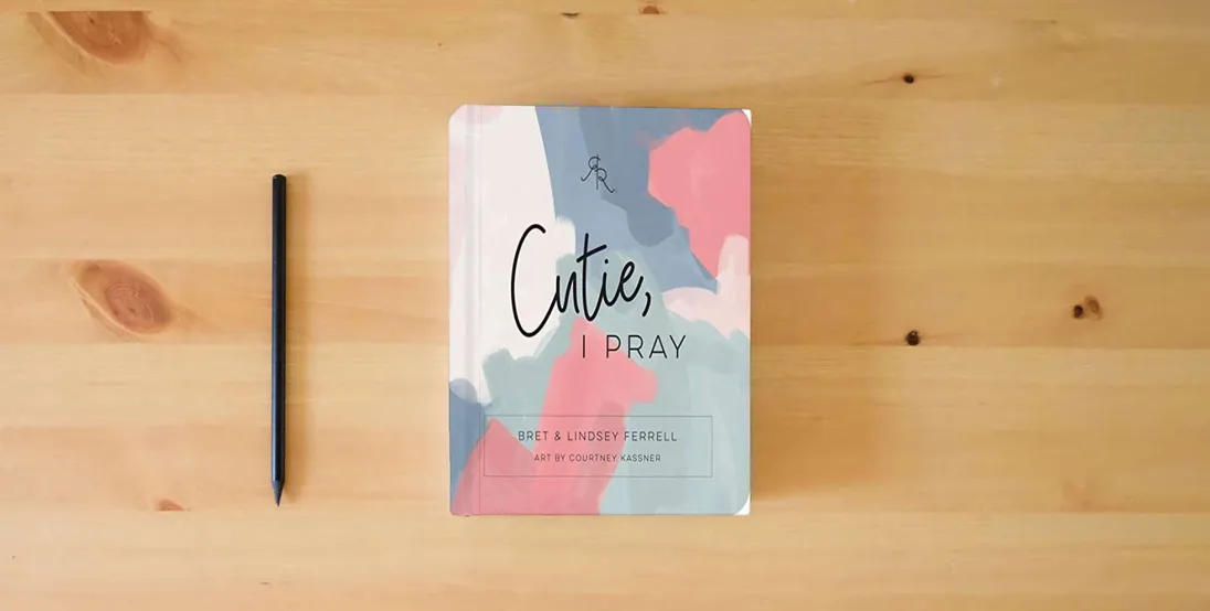 The book Cutie, I Pray (Ryan & Rose)} is on the table