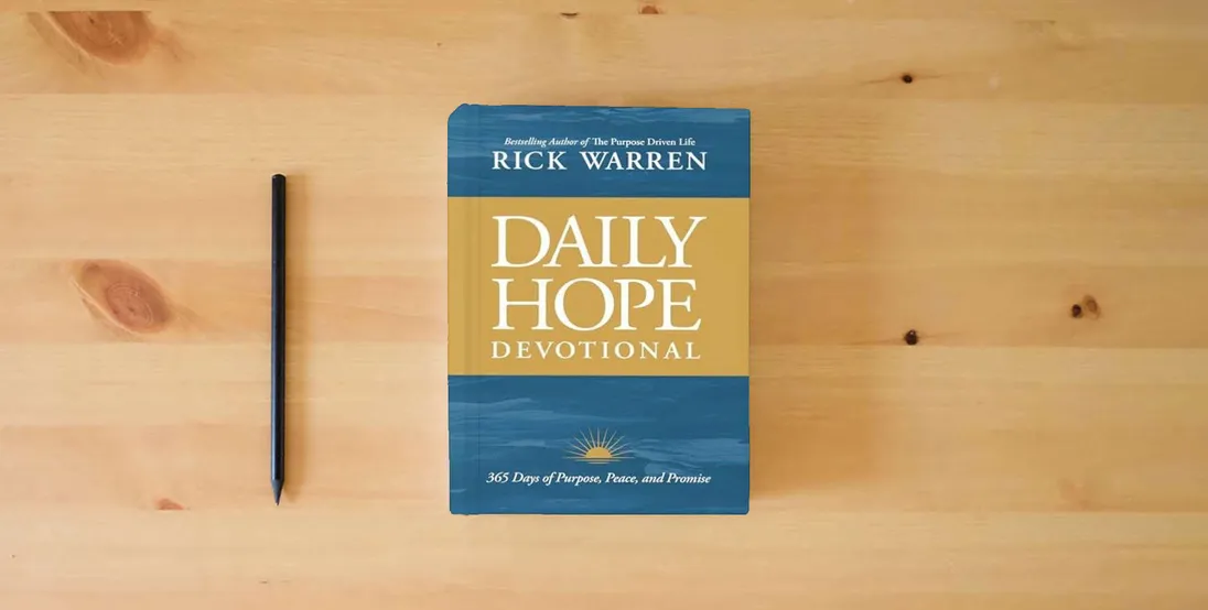 The book Daily Hope Devotional: 365 Days of Purpose, Peace, and Promise} is on the table