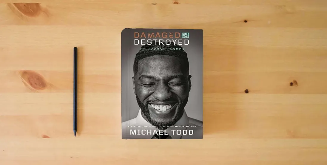 The book Damaged but Not Destroyed: From Trauma to Triumph} is on the table
