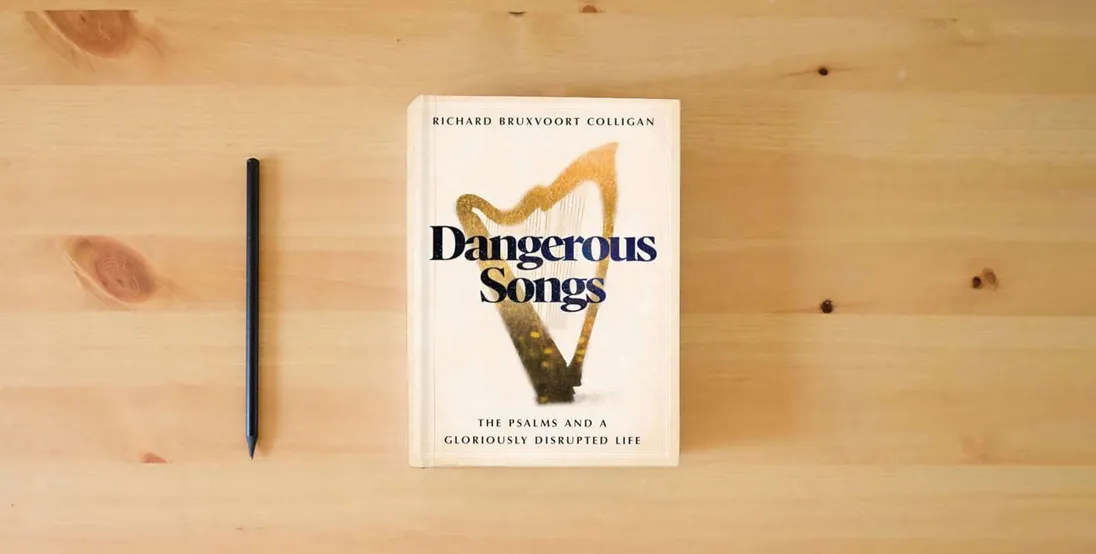 The book Dangerous Songs: The Psalms and a Gloriously Disrupted Life} is on the table