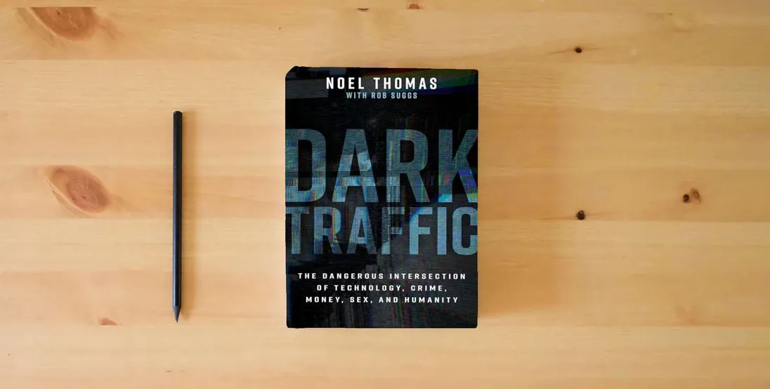 The book Dark Traffic: The Dangerous Intersection of Technology, Crime, Money, Sex, and Humanity} is on the table