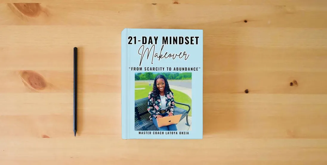 The book 21-Day Mindset Makeover: From Scarcity To Abundance} is on the table