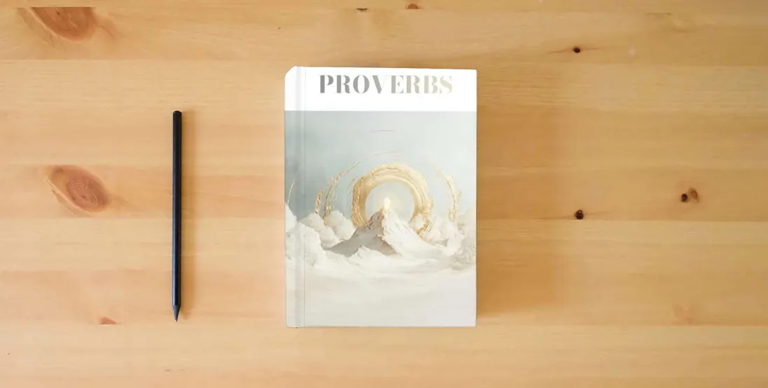 The book Elegant Bible: The Book Proverbs} is on the table