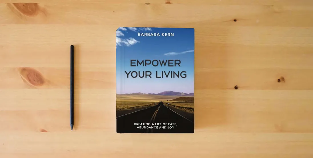 The book EMPOWER YOUR LIVING: Creating a Life of Ease, Abundance and Joy} is on the table