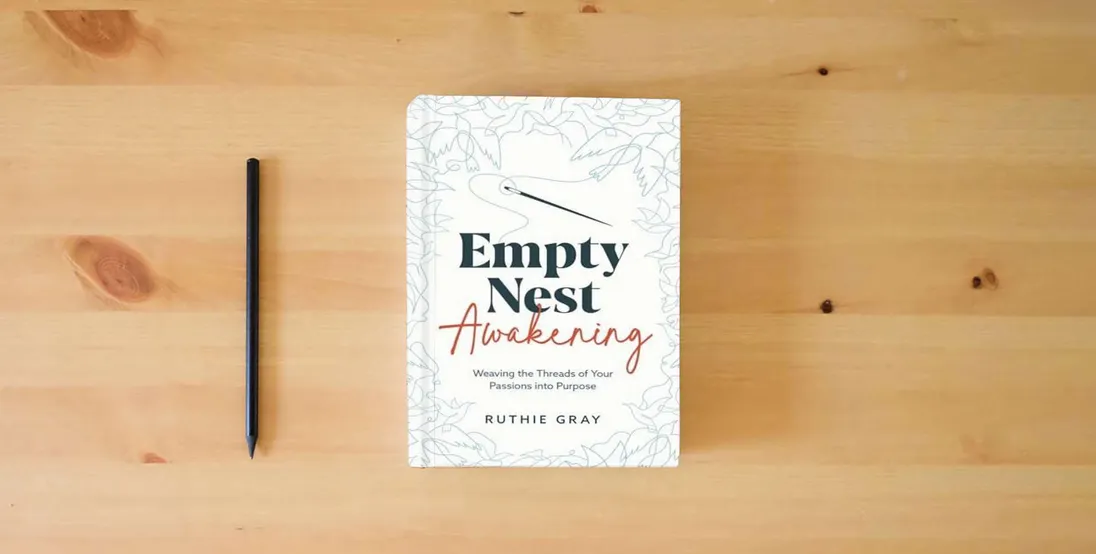 The book Empty Nest Awakening: Weaving the Threads of Your Passion into Purpose} is on the table