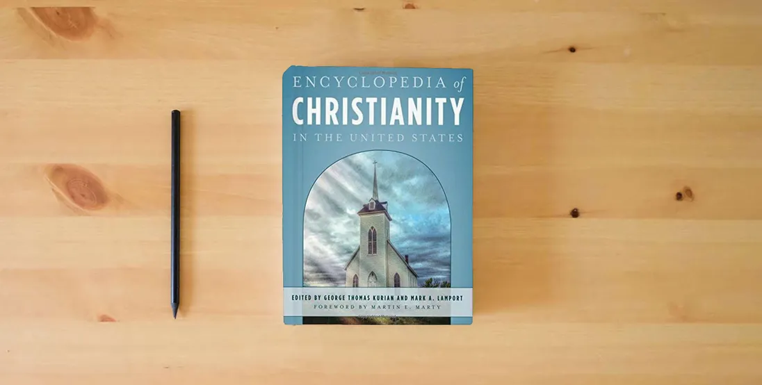 The book Encyclopedia of Christianity in the United States (5 Volume Set)} is on the table