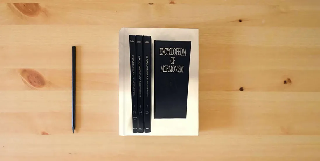 The book Encyclopedia of Mormonism (4-volume set)} is on the table