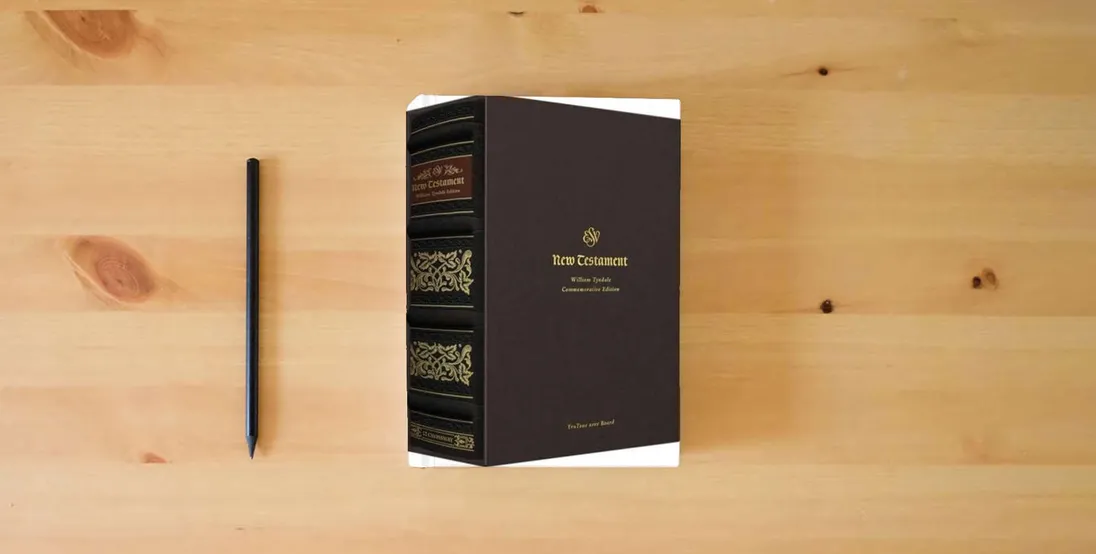 The book ESV New Testament with Illuminated Drop Caps: William Tyndale Commemorative Edition (TruTone over Board)} is on the table