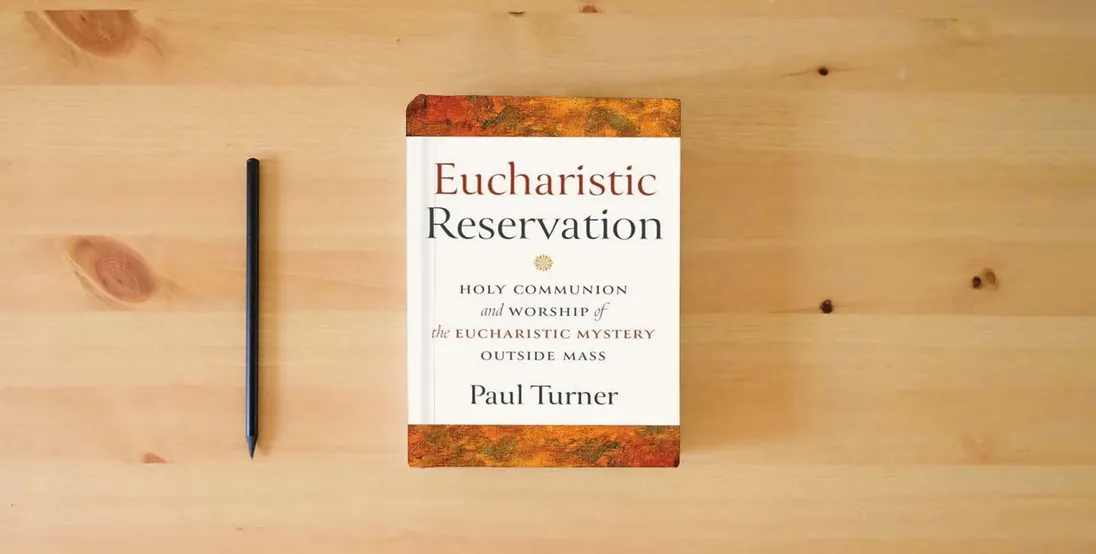 The book Eucharistic Reservation: Holy Communion and Worship of the Eucharistic Mystery Outside Mass} is on the table