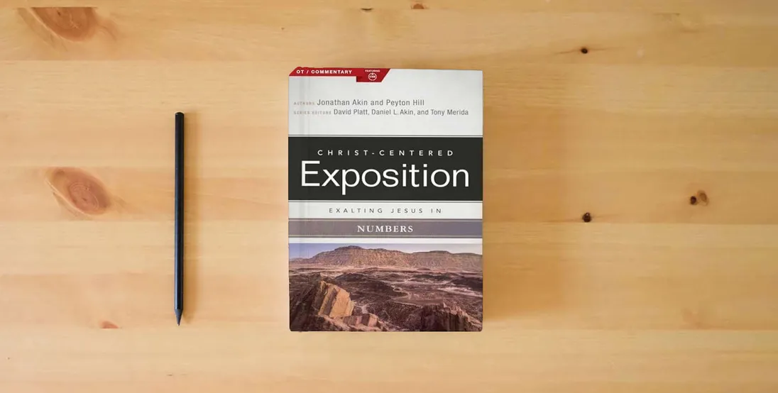 The book Exalting Jesus in Numbers (Christ-Centered Exposition Commentary)} is on the table