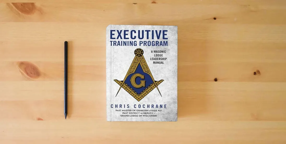 The book Executive Training Program: A Masonic Lodge Leadership Manual} is on the table