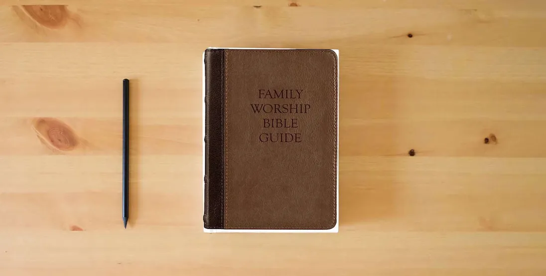 The book Family Worship Bible Guide (Two-Tone Brown)} is on the table