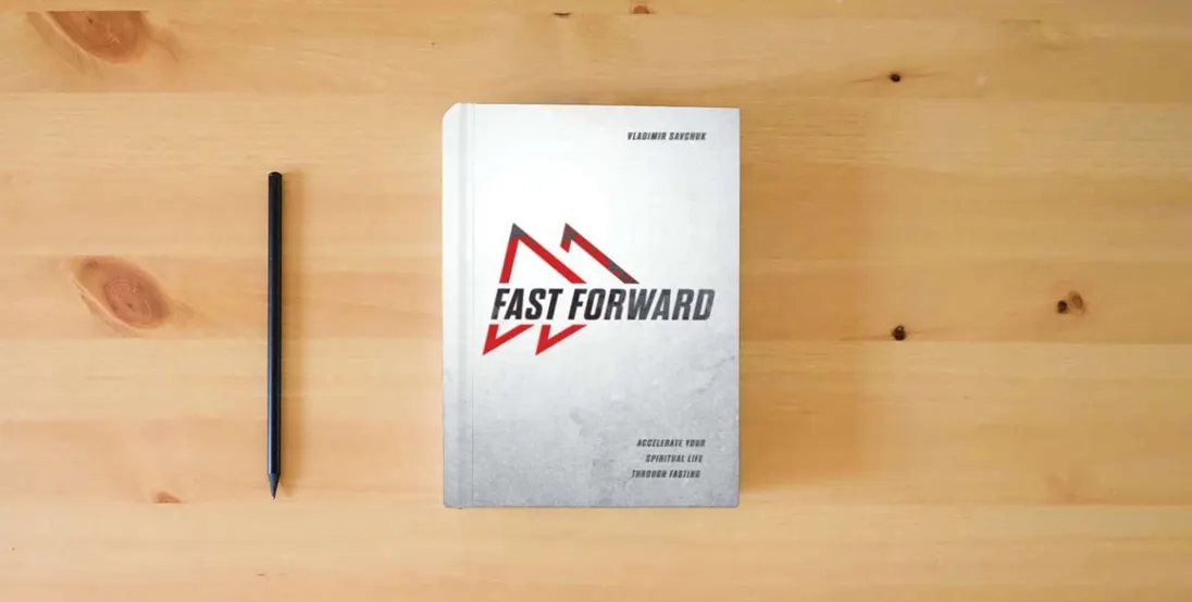 The book Fast Forward: Accelerate your spiritual life through fasting} is on the table