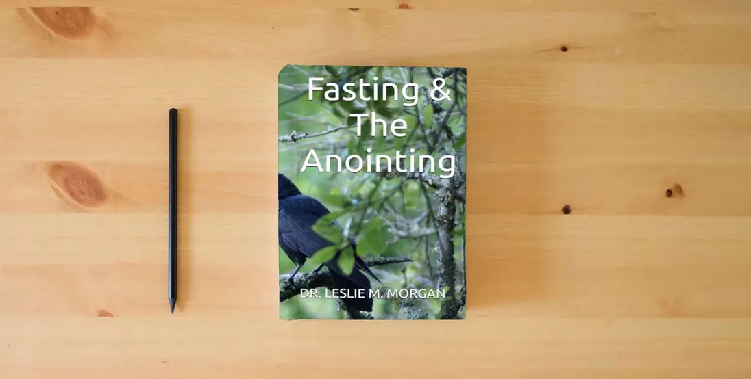 The book Fasting & The Anointing} is on the table