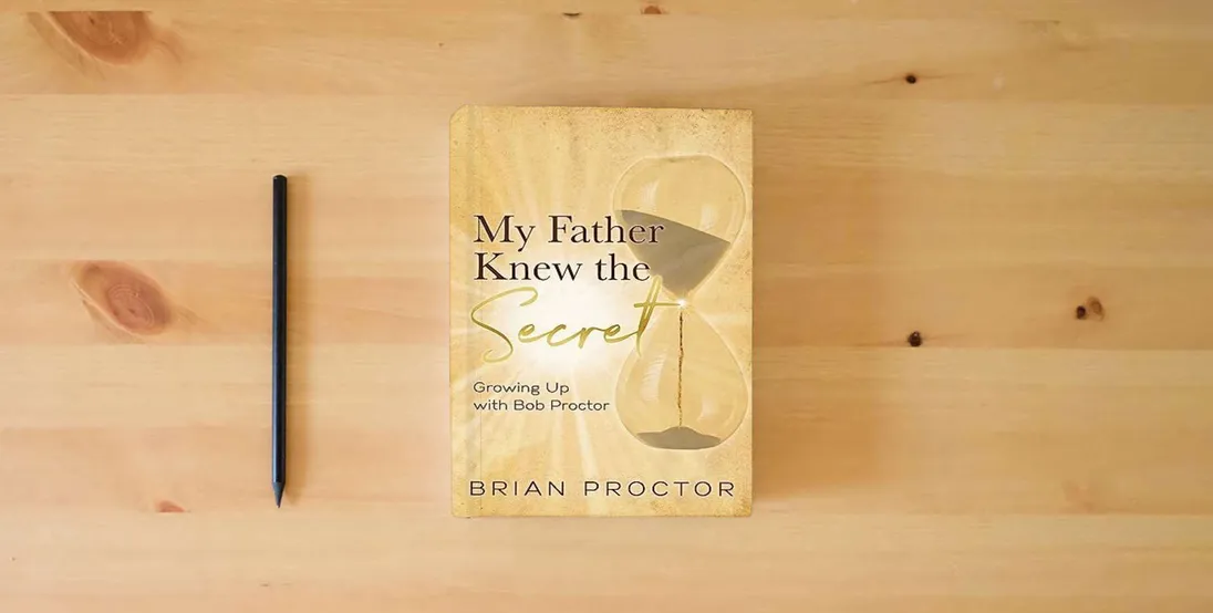 The book My Father Knew the Secret: Growing Up with Bob Proctor} is on the table