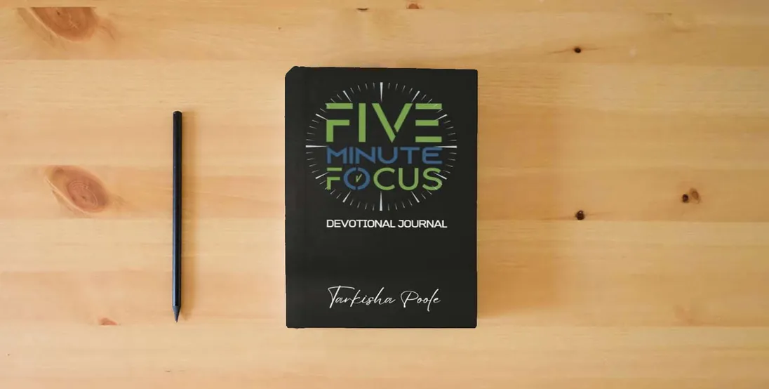 The book Five-Minute Focus Devotional Journal} is on the table