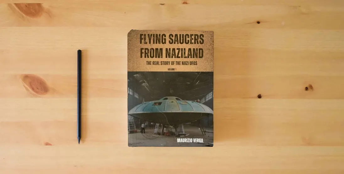 The book Flying Saucers from Naziland: The real story of the Nazi UFOs} is on the table