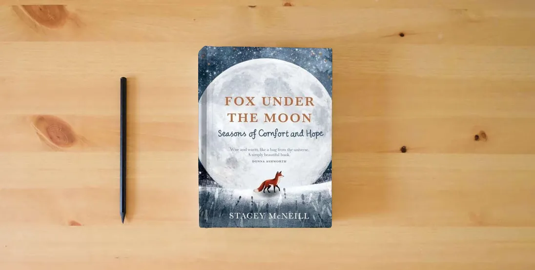 The book Fox Under the Moon: Seasons of Comfort and Hope} is on the table