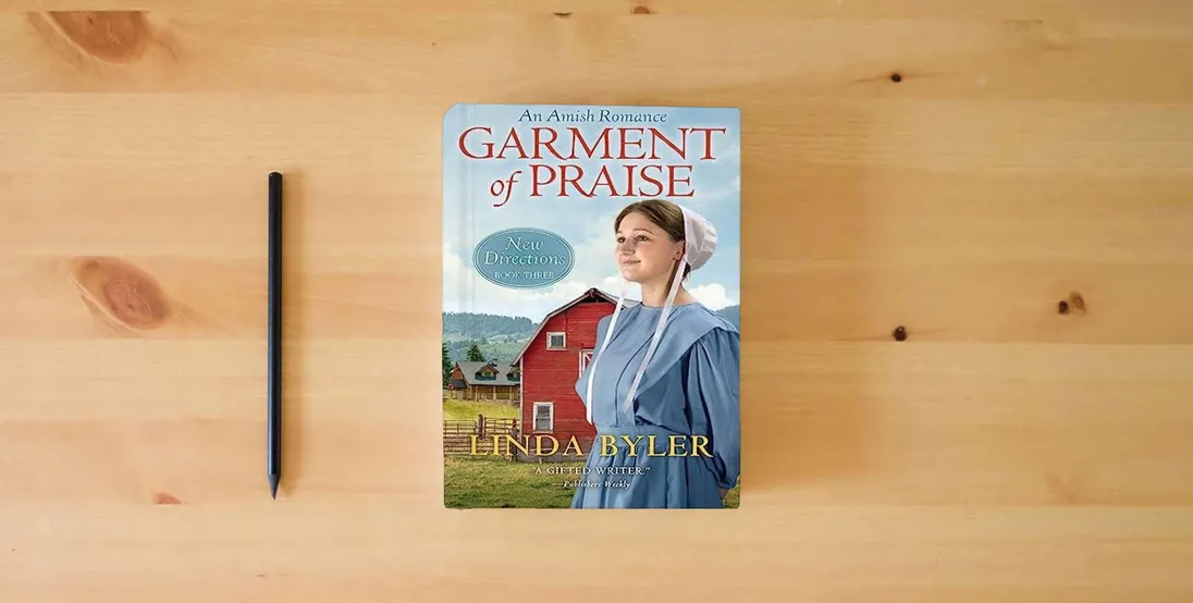 The book Garment of Praise: New Directions Book Three} is on the table