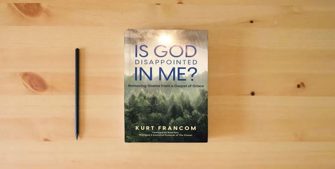 The book Is God Disappointed In Me?} is on the table
