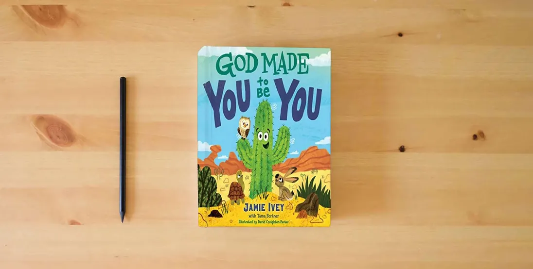The book God Made You to Be You} is on the table
