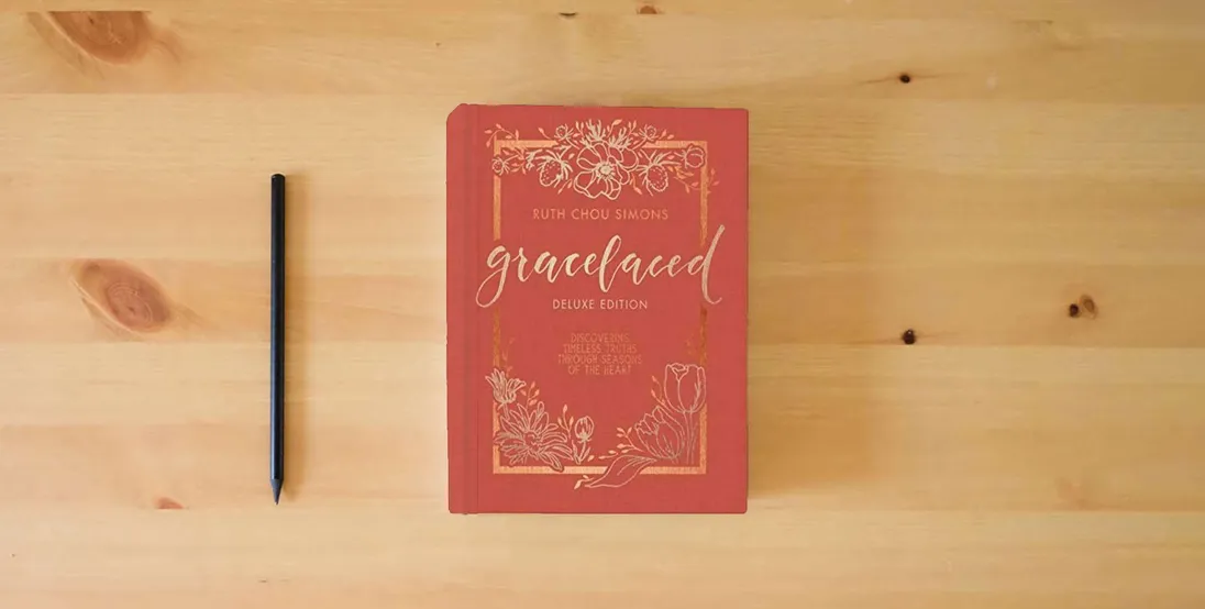 The book GraceLaced Deluxe Edition} is on the table