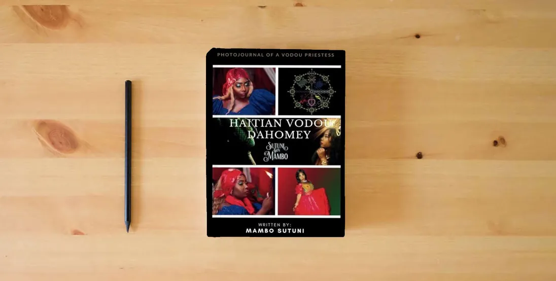 The book Haitian Vodou Dahomey: Volume 1} is on the table