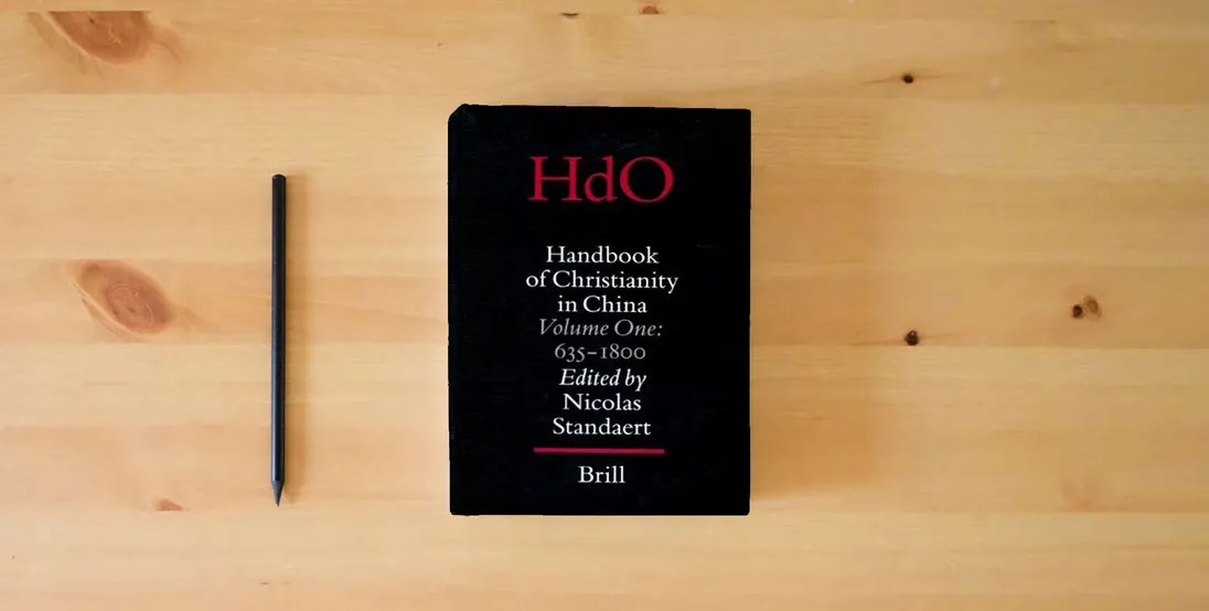 The book Handbook of Christianity in China: 635 - 1800 (Handbook of Oriental Studies/Handbuch Der Orientalistik - Part 4: China, 15)} is on the table