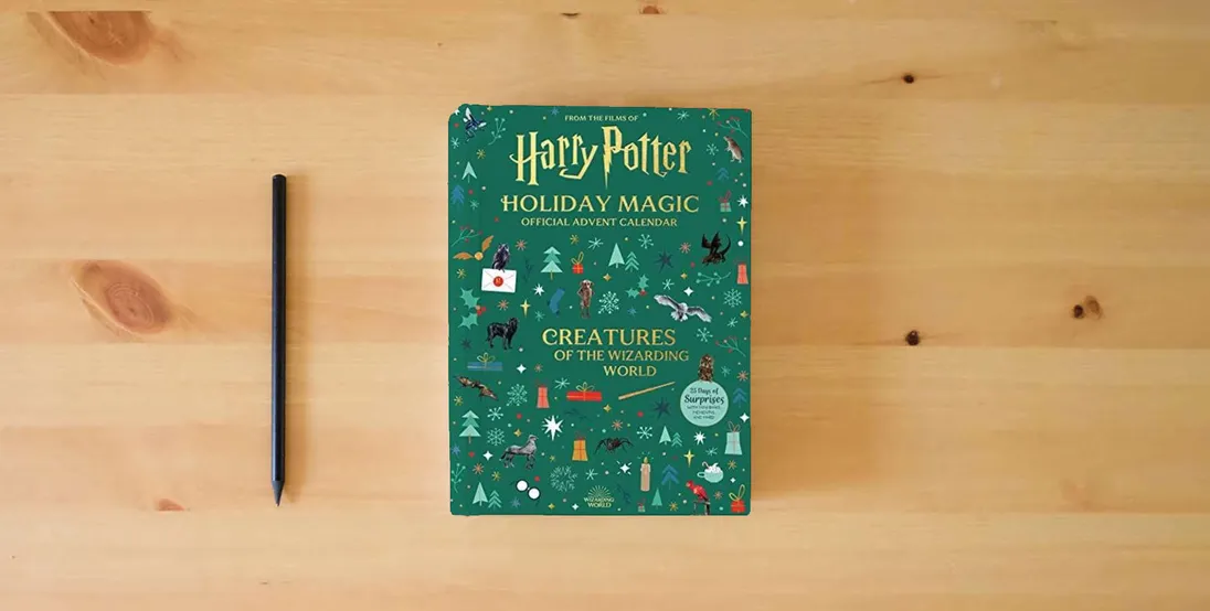 The book Harry Potter Holiday Magic: Official Advent Calendar: Creatures of the Wizarding World} is on the table