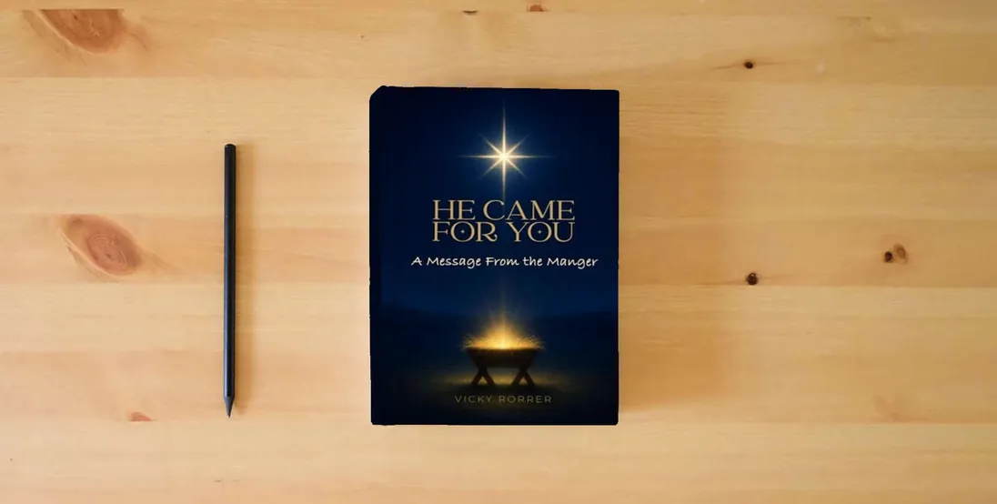 The book HE CAME FOR YOU} is on the table