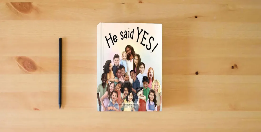 The book He said YES!} is on the table
